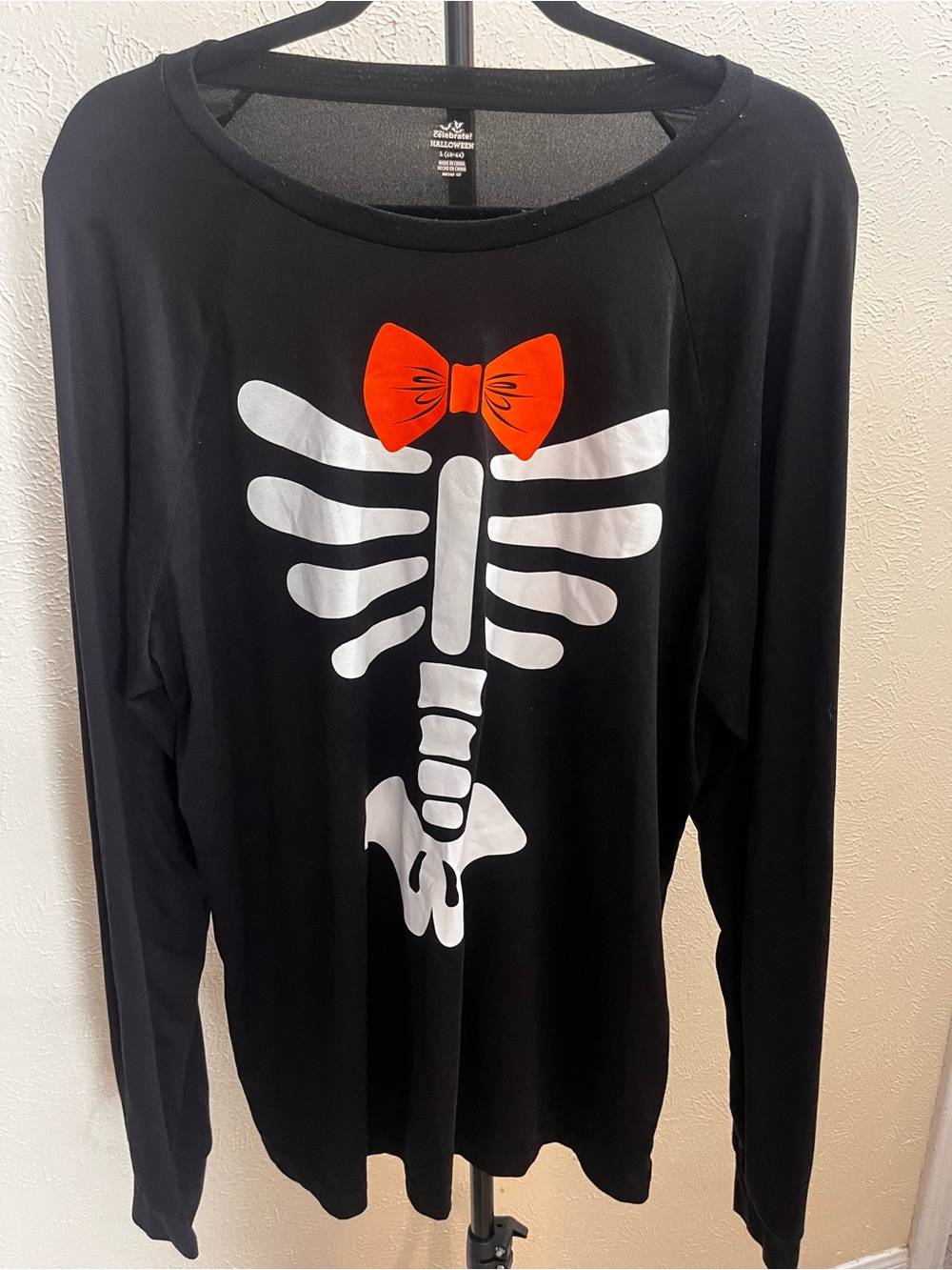 Celebrate Halloween Black Long-Sleeve Skeleton Tee with Orange Bow Accent